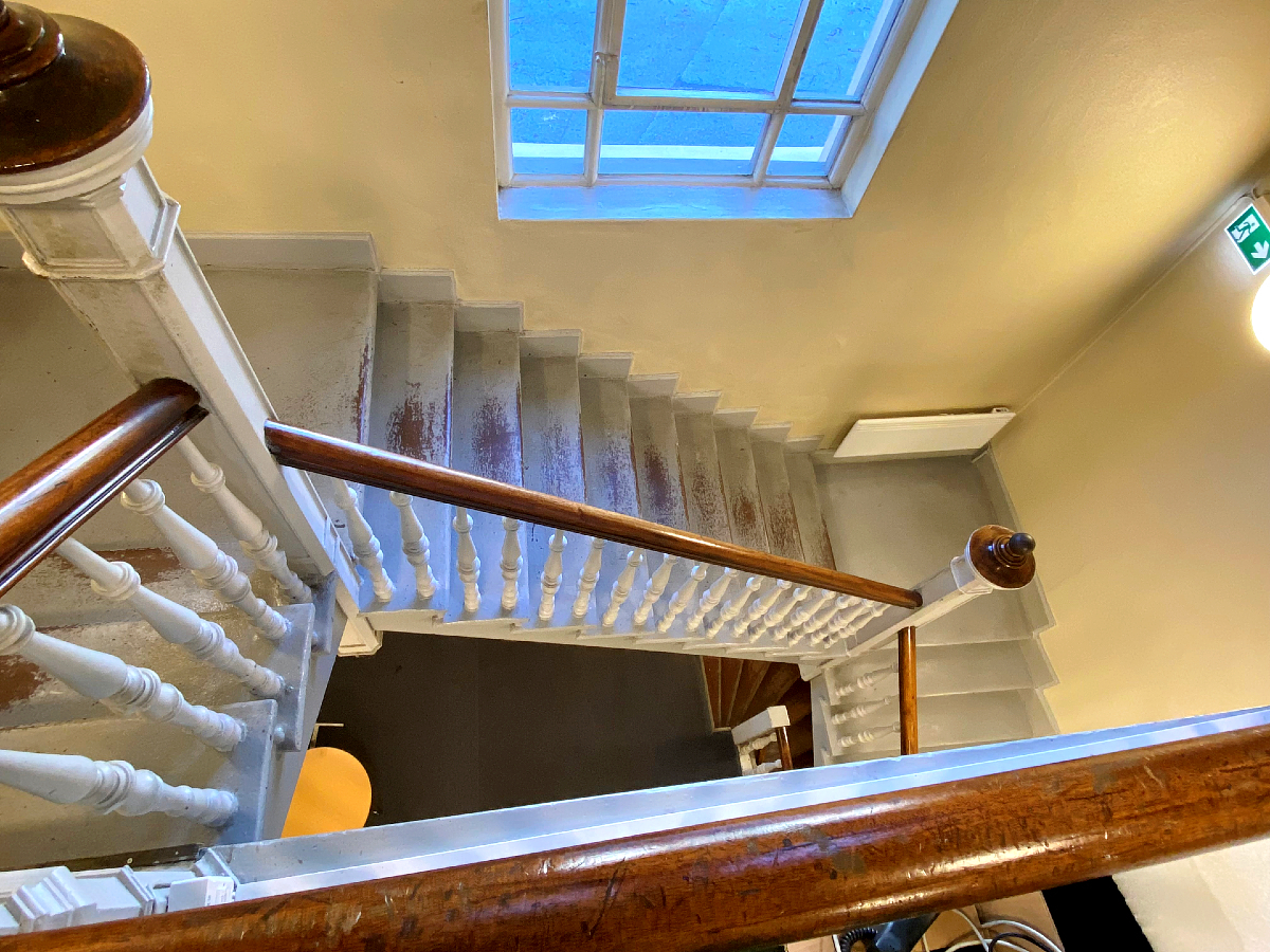 Image may contain: Stairs, Wood, Handrail, Interior design, Flooring.
