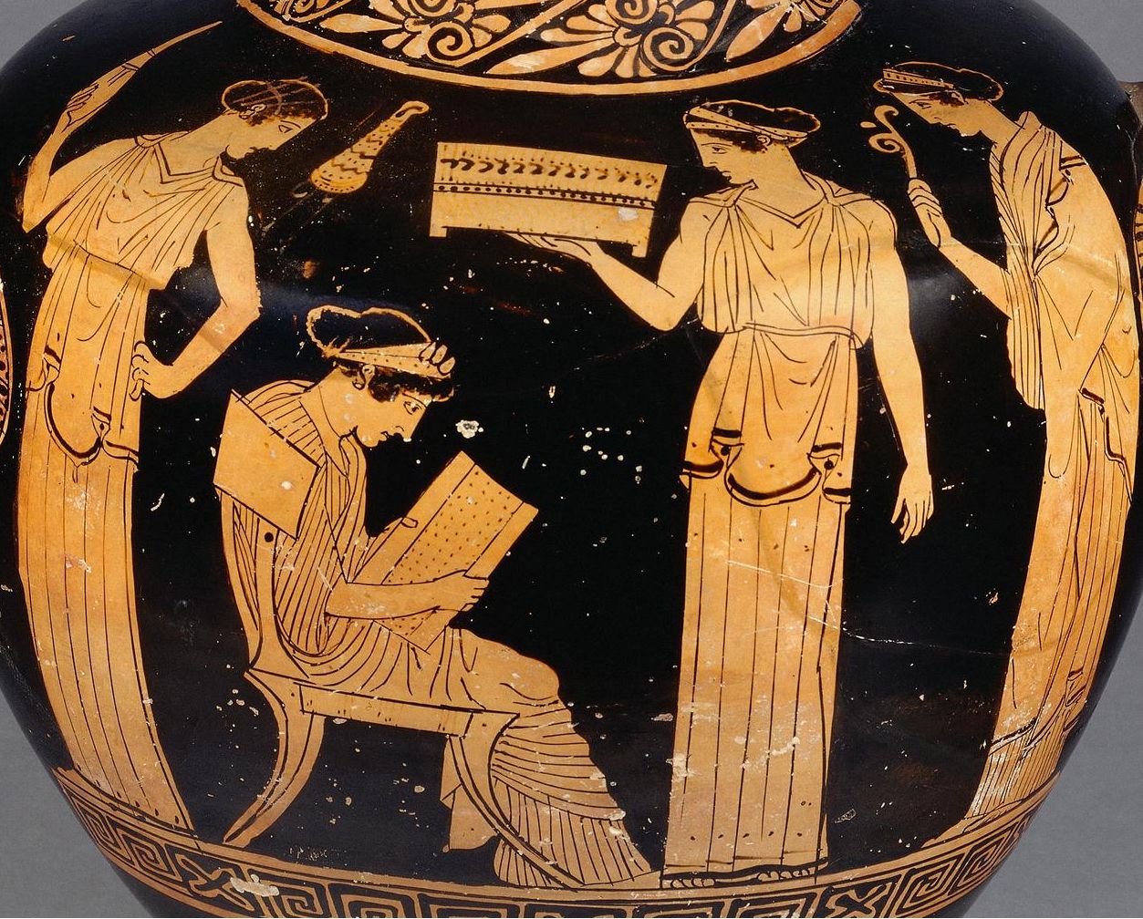 Red-figured water-jar. Woman reading, and three attendants.