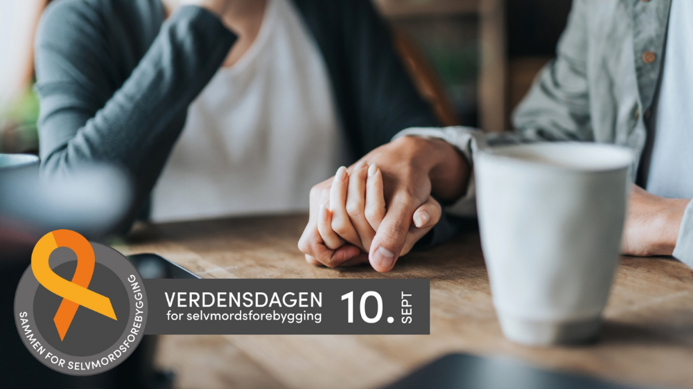 To personer holder hender. Det står en kaffekopp på bordet. På bildet står det "Verdensdagen for selvmordsforebygging 10. sept"